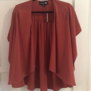 Fashion jacket in the color rust. Never been worn